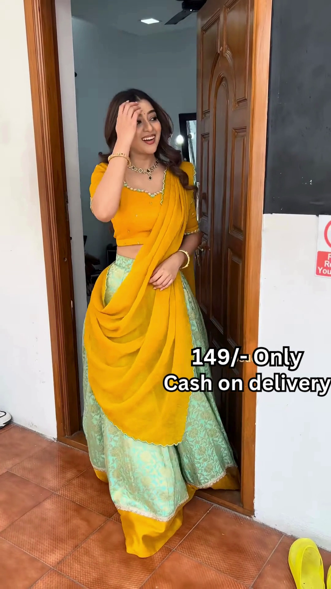 Women’s Red Embroidered Skirt Top Set with Traditional Earrings – Ethnic Doorway Portrait Ensemble