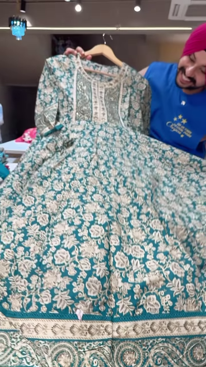 Women’s Teal Embroidered Long Kurti with Beige Floral & Paisley Motifs – Ethnicwear Portrait Piece for Seasonal Styling