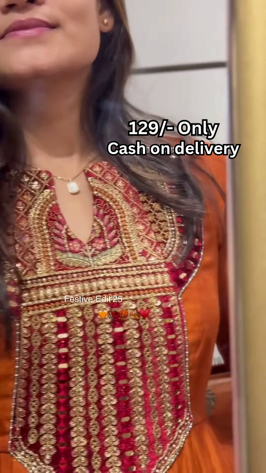 Women’s Orange Embroidered Kurti with Gold & Red Threadwork – Festive Ethnicwear Styled with Black Clutch Accessory