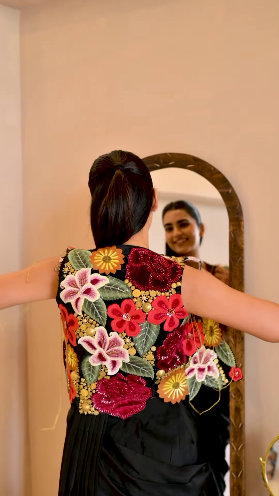 Women’s Black Saree with Gold Embellishments & Pleated Draping – Elegant Ethnicwear Styled with Traditional Bracelet