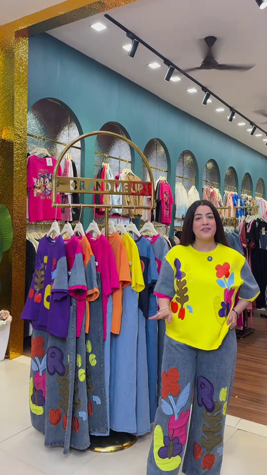 Multicolor Printed Ethnicwear Rack Display β Bold Floral & Abstract Garments in Boutique Interior with Teal-Gold Accents