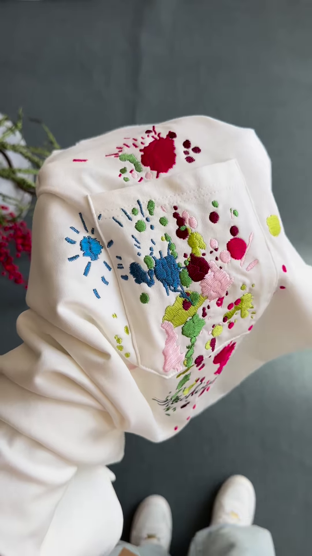 Unisex White & Beige T-Shirts with Colorful Paint Splatter and Pocket Embroidery – Artistic Casualwear for Everyday Styling