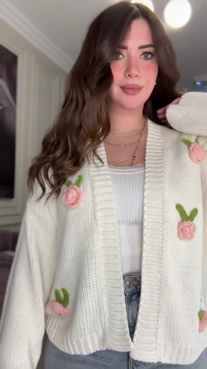 White Knit Cardigan with Pink Floral Appliqué 🌸🤍 – Button-Up Layer Styled with Gold Necklaces & Light Denim