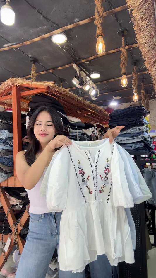 White Floral Embroidered Blouse with Light Blue Jeans – Casual Boutique Look for Women