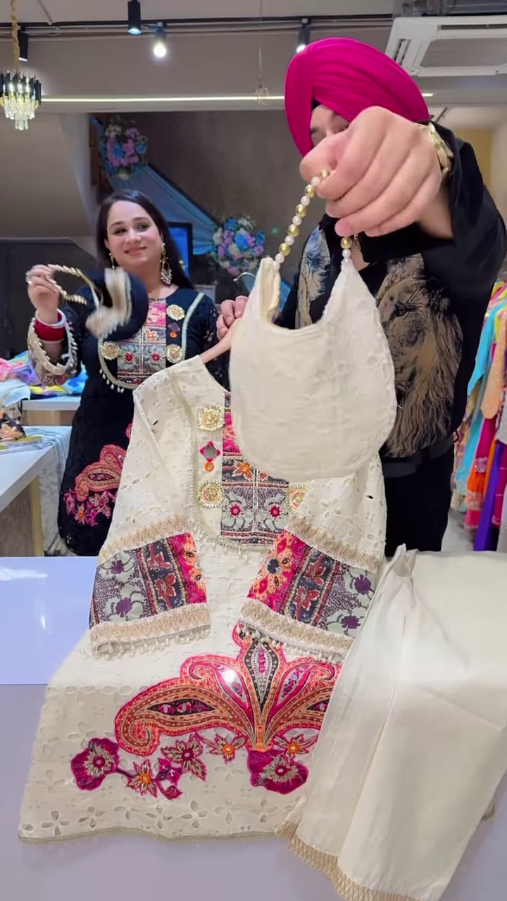 Black Embroidered Ethnic Dress with Multicolor Floral and Geometric Patterns, Tassel Accents