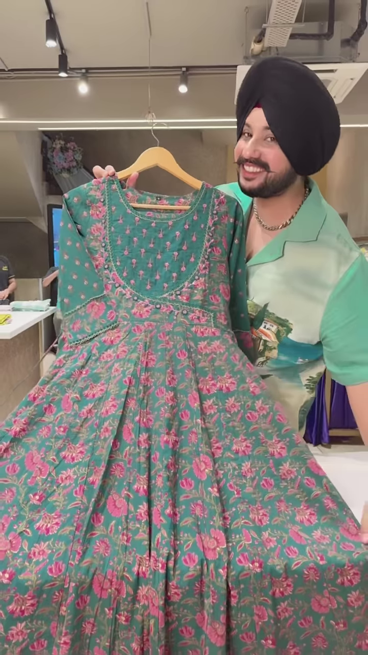 Green Floral Printed Ethnic Dress with Embroidered Neckline and Coordinated Fabric Panel