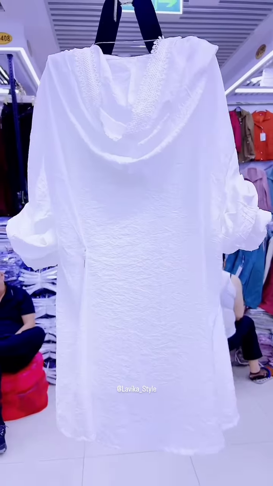 Elegant White Layered Outfit with Striking Blue Necklace