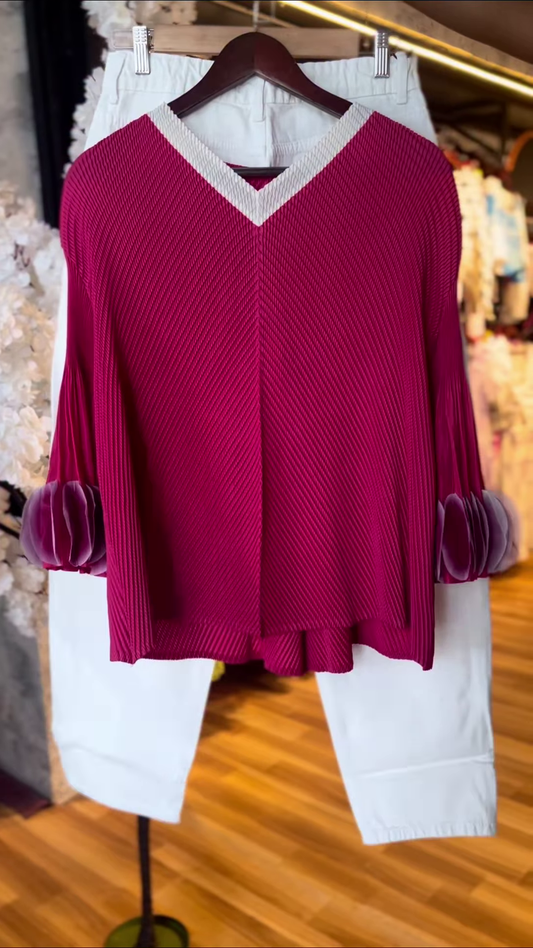 Women’s Textured Red Long-Sleeve Top with V-Neck Collar & Pleated Sleeve Detail – Paired with White Slim Pants