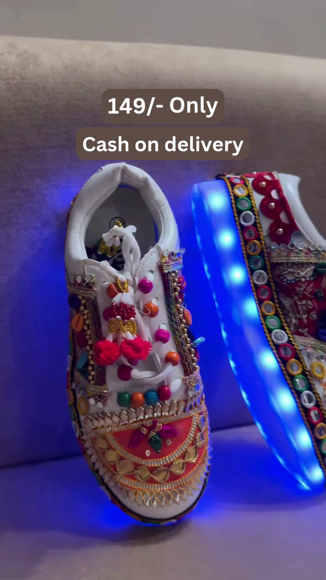 Unisex White Ethnic Mojari Footwear with Multicolor Bead Embroidery – Festive Pair with Red Light Showcase Styling