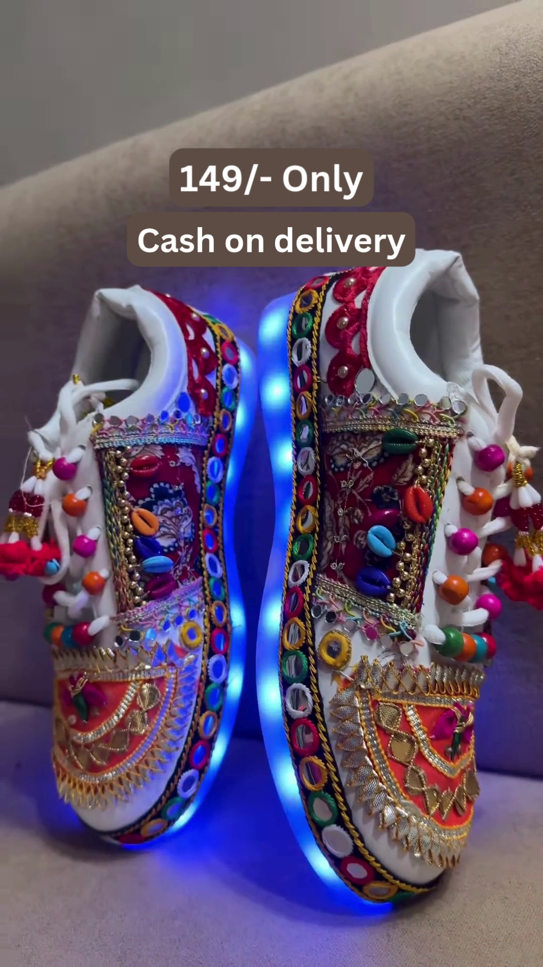 Unisex White Ethnic Mojari Footwear with Multicolor Bead Embroidery – Festive Pair with Red Light Showcase Styling