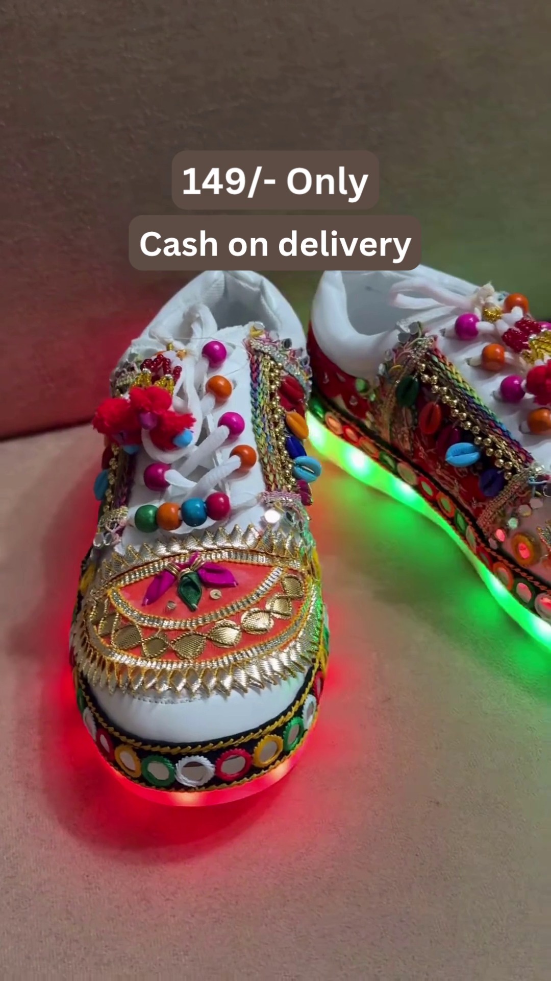 Unisex White Ethnic Mojari Footwear with Multicolor Bead Embroidery – Festive Pair with Red Light Showcase Styling
