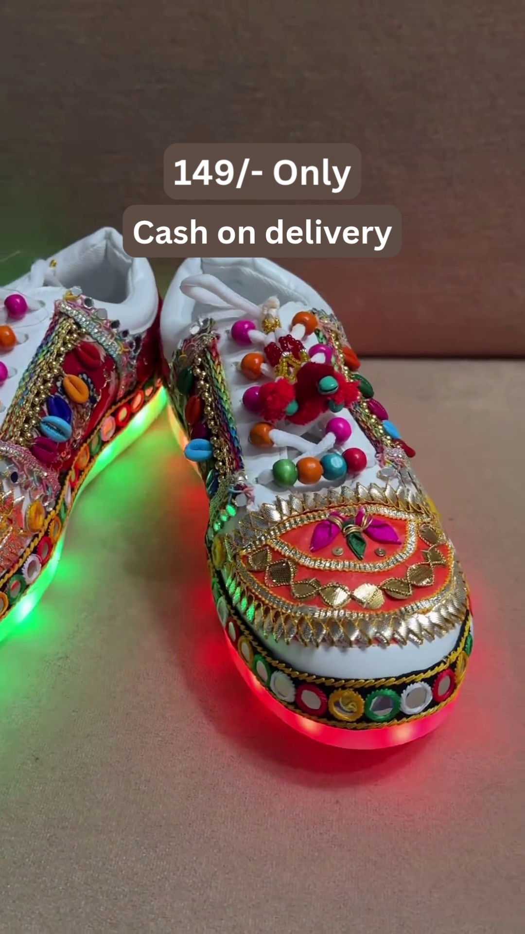 Unisex White Ethnic Mojari Footwear with Multicolor Bead Embroidery – Festive Pair with Red Light Showcase Styling