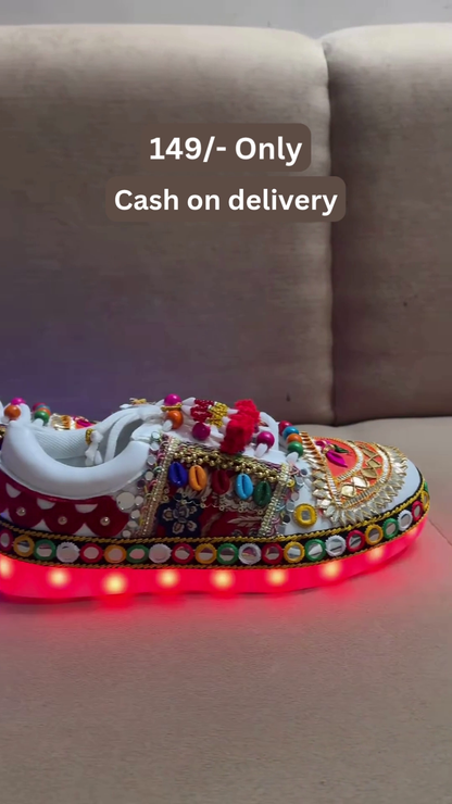 Unisex White Ethnic Mojari Footwear with Multicolor Bead Embroidery – Festive Pair with Red Light Showcase Styling