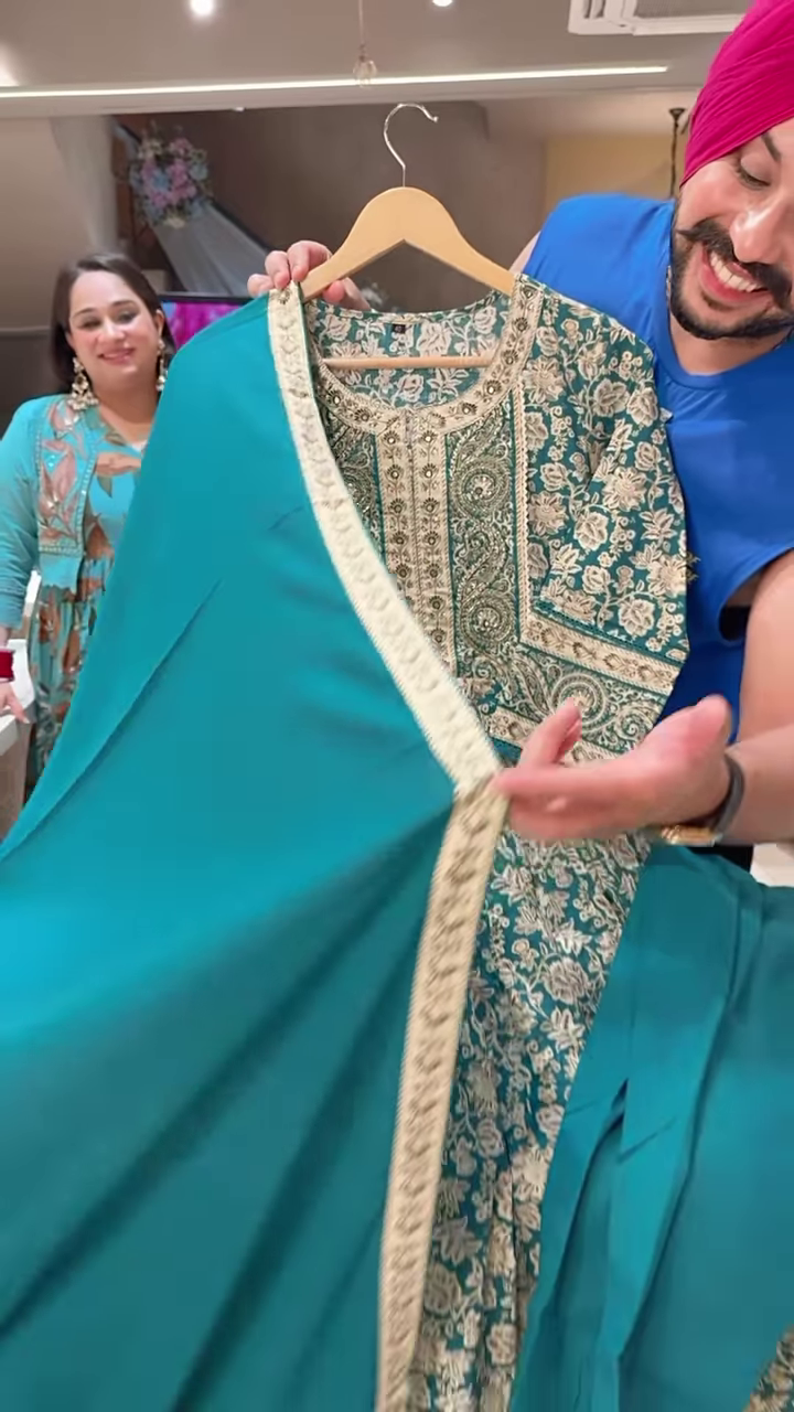 Women’s Teal Embroidered Long Kurti with Beige Floral & Paisley Motifs – Ethnicwear Portrait Piece for Seasonal Styling