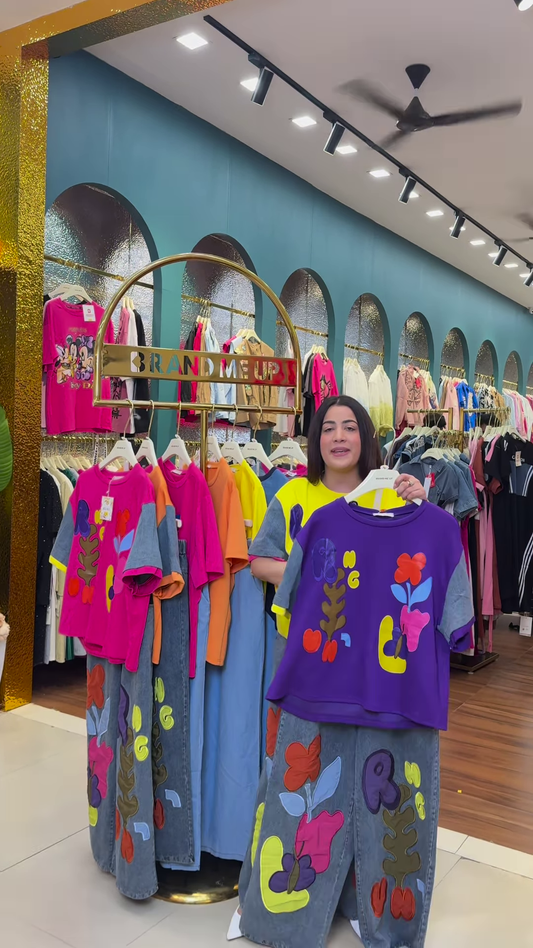 Multicolor Printed Ethnicwear Rack Display – Bold Floral & Abstract Garments in Boutique Interior with Teal-Gold Accents
