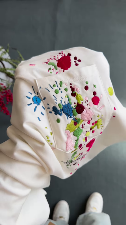 Unisex White & Beige T-Shirts with Colorful Paint Splatter and Pocket Embroidery – Artistic Casualwear for Everyday Styling