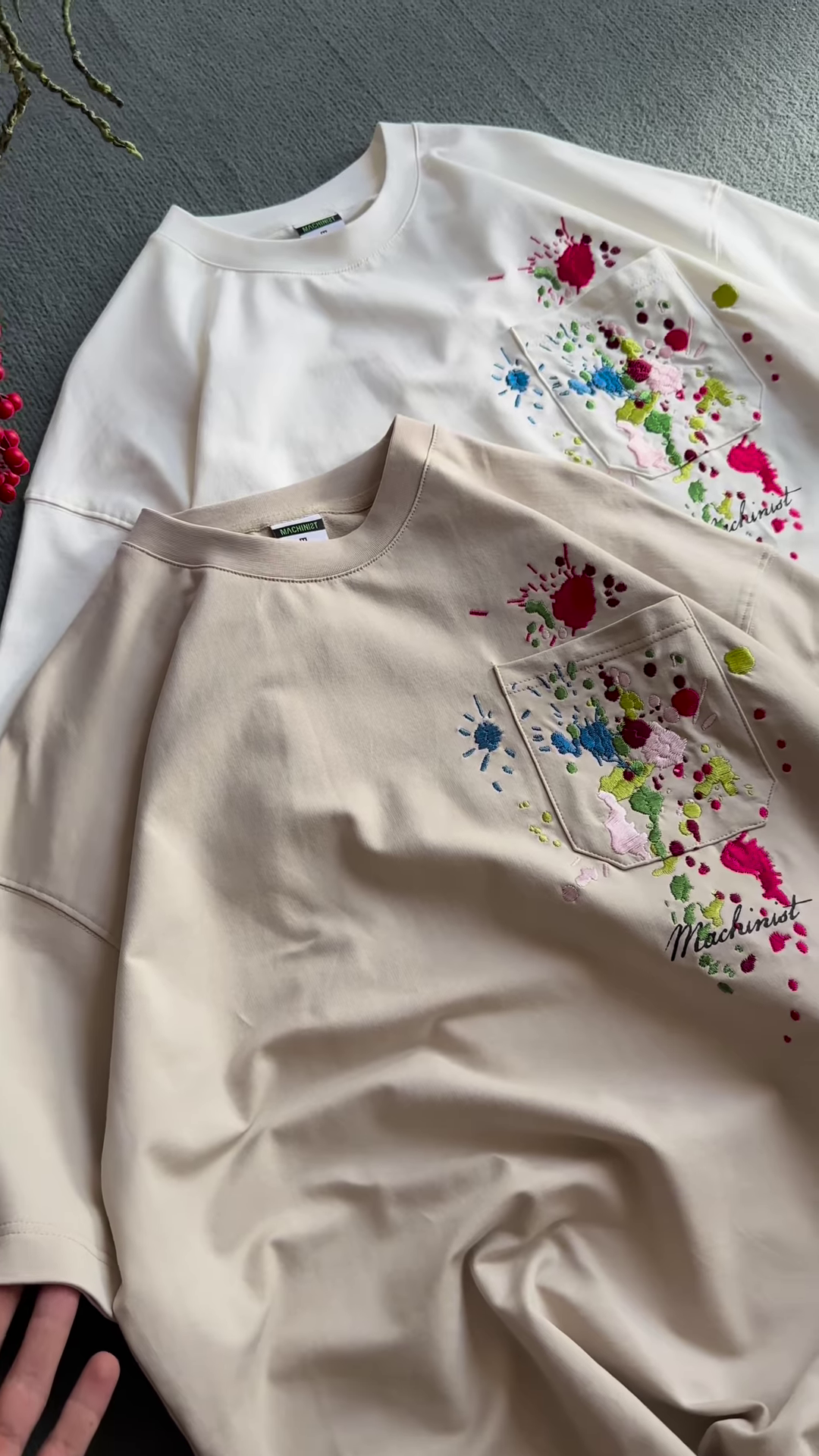 Unisex White & Beige T-Shirts with Colorful Paint Splatter and Pocket Embroidery – Artistic Casualwear for Everyday Styling