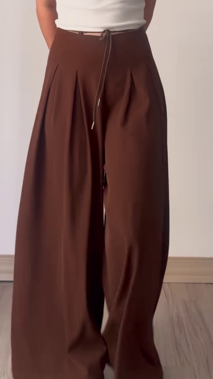 Women’s Beige Wide-Leg Pleated Pants with Drawstring Waist – Flowing Casualwear Styled with White Sneakers