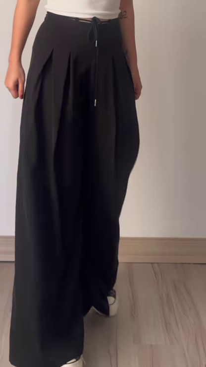 Women’s Beige Wide-Leg Pleated Pants with Drawstring Waist – Flowing Casualwear Styled with White Sneakers