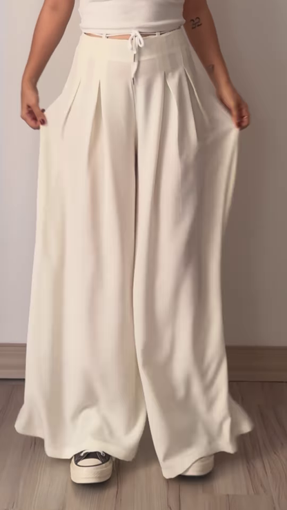 Women’s Beige Wide-Leg Pleated Pants with Drawstring Waist – Flowing Casualwear Styled with White Sneakers