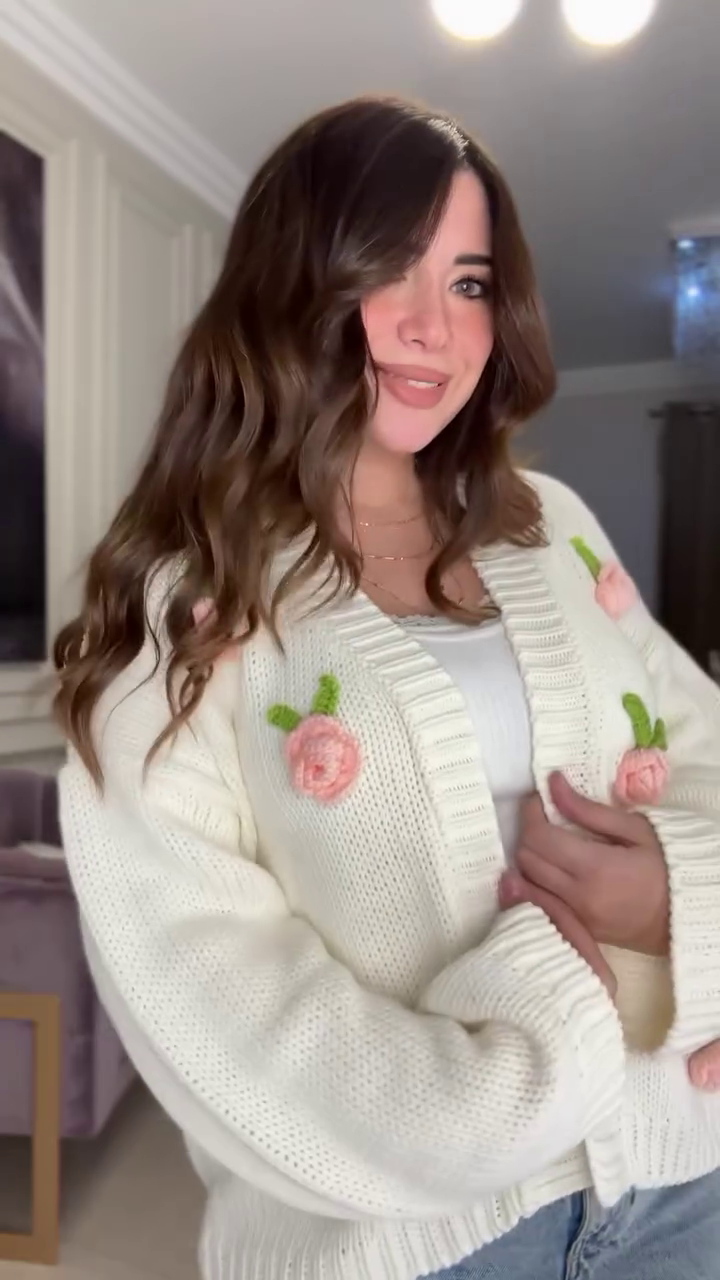 White Knit Cardigan with Pink Floral Appliqué 🌸🤍 – Button-Up Layer Styled with Gold Necklaces & Light Denim