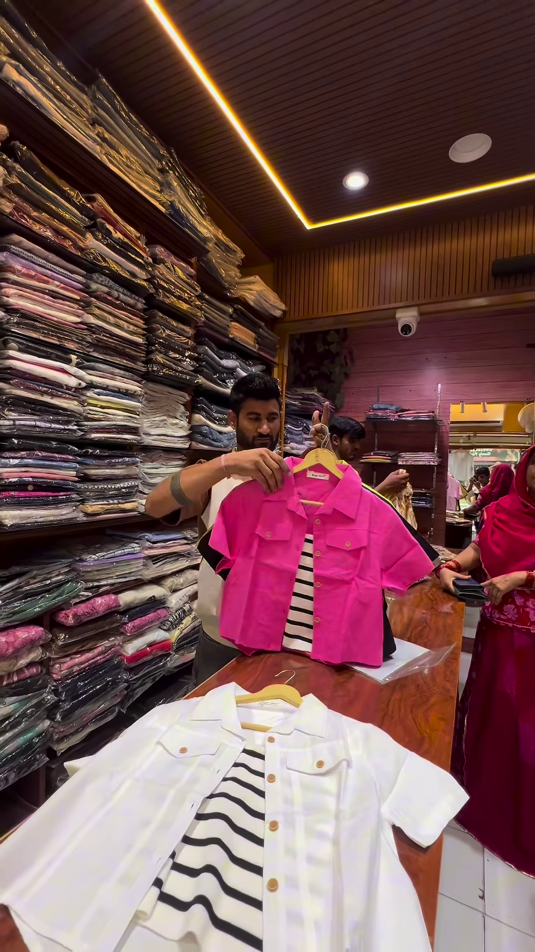 White Buttoned Utility Jacket with Chest Flap Pockets over Striped Inner Layer