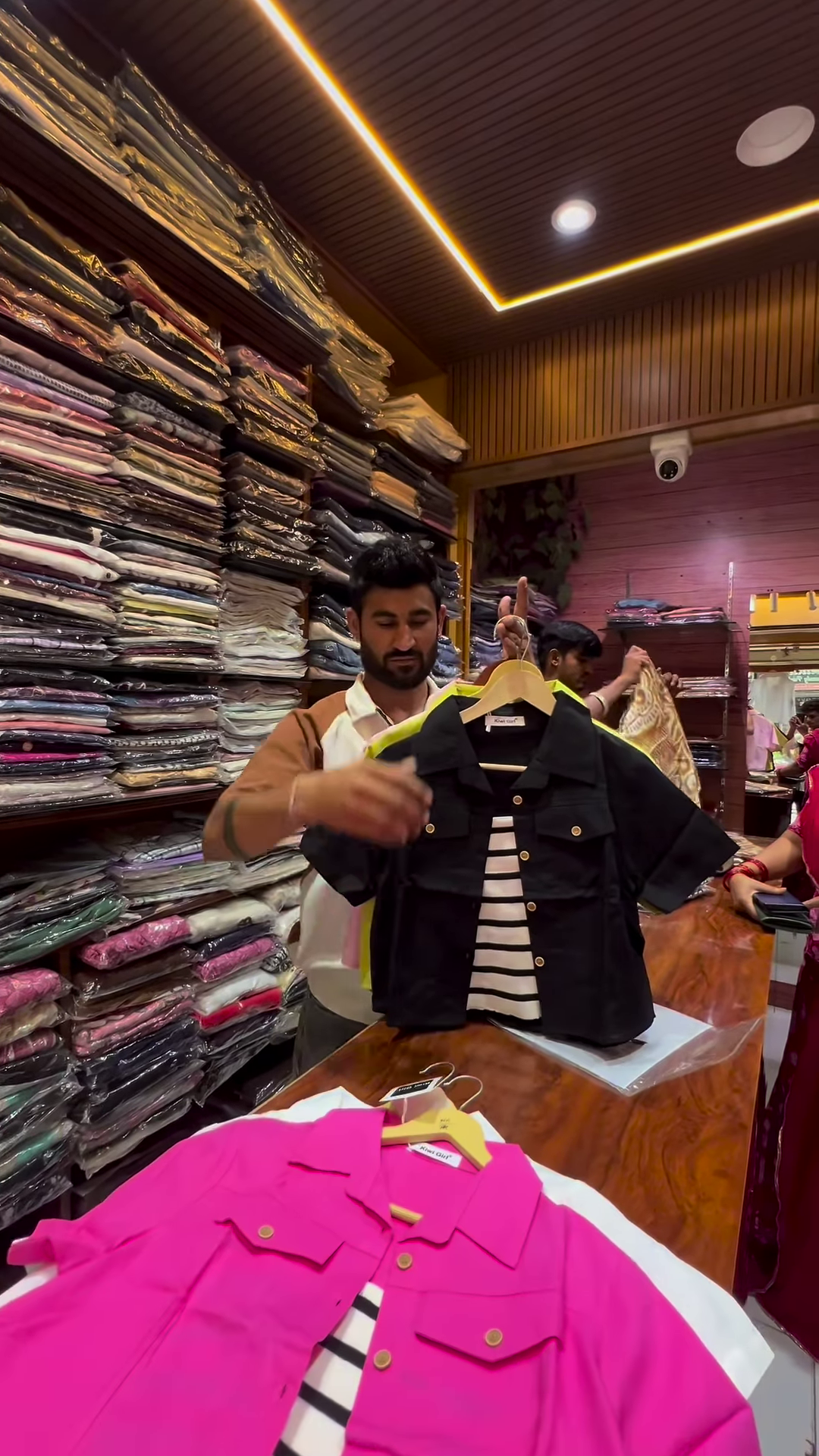 White Buttoned Utility Jacket with Chest Flap Pockets over Striped Inner Layer