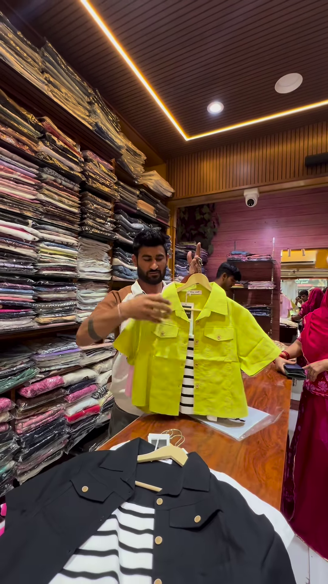 White Buttoned Utility Jacket with Chest Flap Pockets over Striped Inner Layer