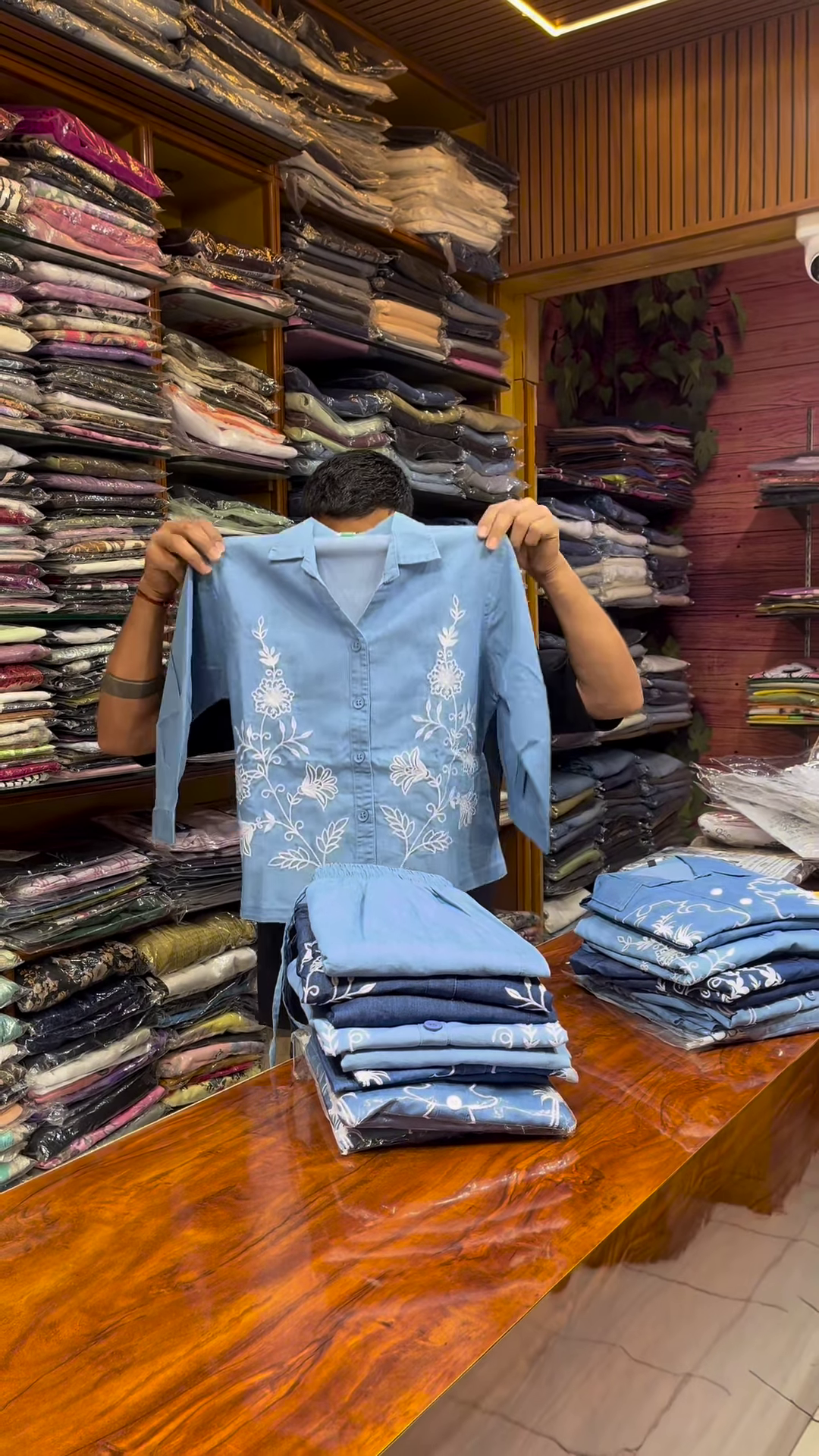 Light Blue Long-Sleeve Shirt with White Floral Embroidery and Button-Front Closure