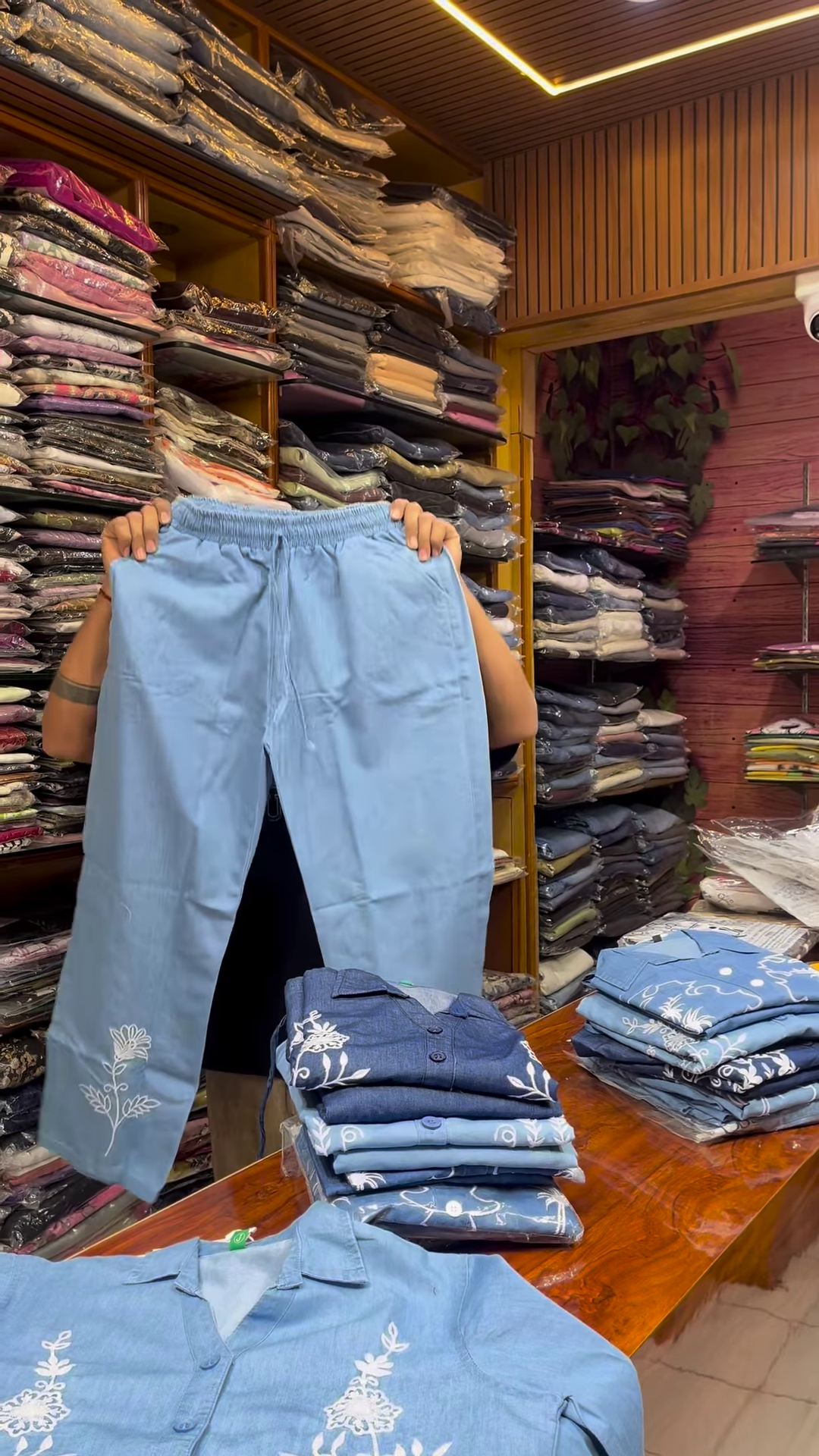 Light Blue Long-Sleeve Shirt with White Floral Embroidery and Button-Front Closure