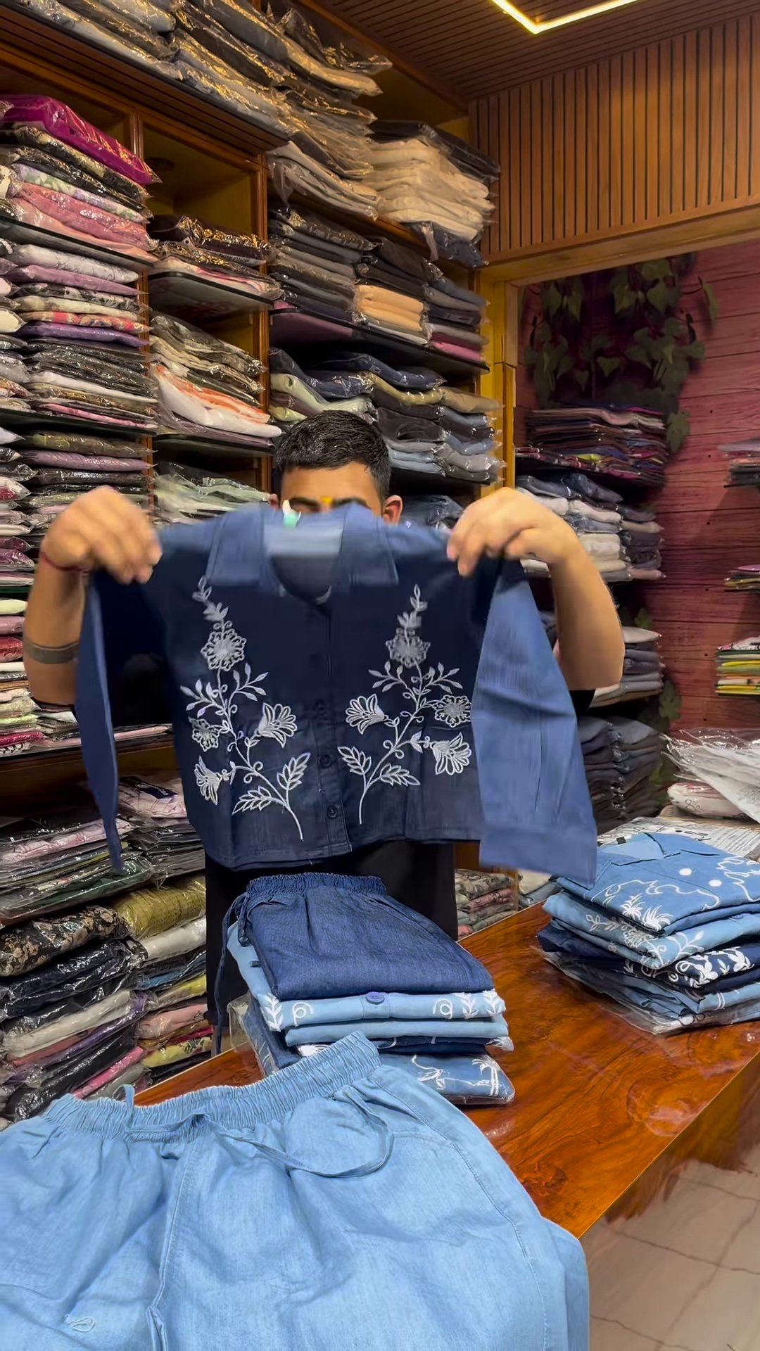 Light Blue Long-Sleeve Shirt with White Floral Embroidery and Button-Front Closure