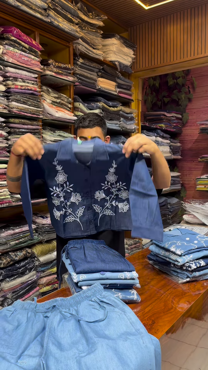 Light Blue Long-Sleeve Shirt with White Floral Embroidery and Button-Front Closure