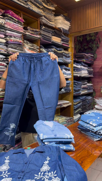Light Blue Long-Sleeve Shirt with White Floral Embroidery and Button-Front Closure