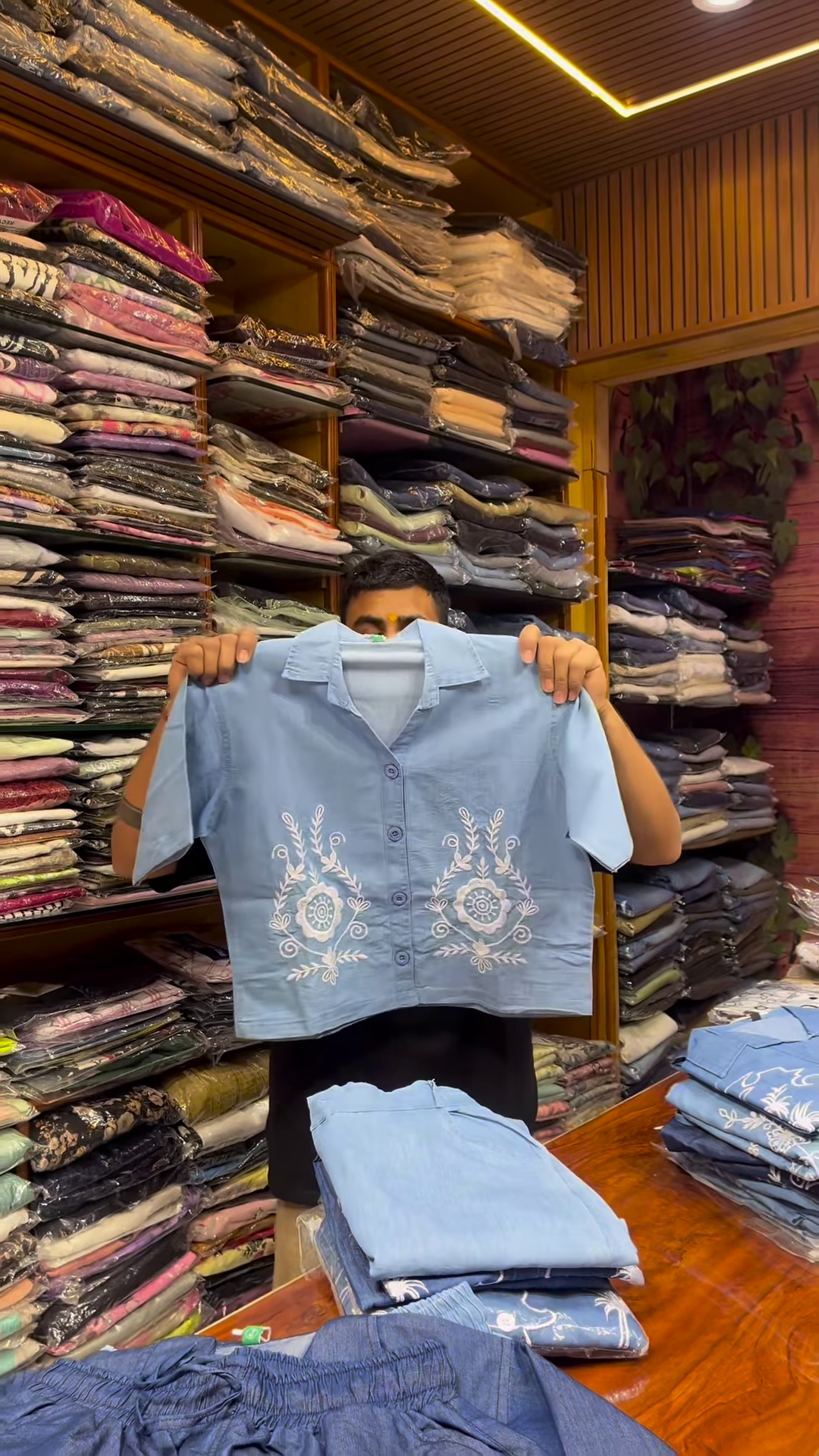 Light Blue Long-Sleeve Shirt with White Floral Embroidery and Button-Front Closure