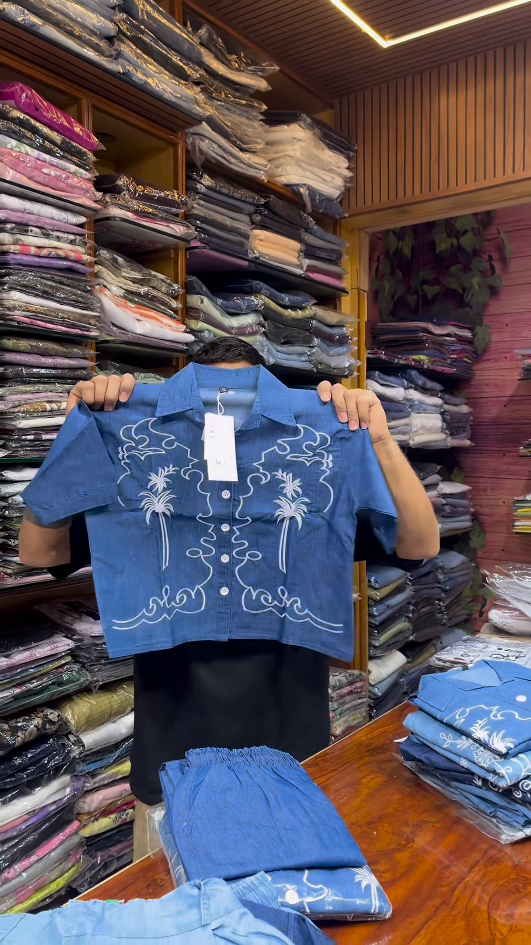 Light Blue Long-Sleeve Shirt with White Floral Embroidery and Button-Front Closure