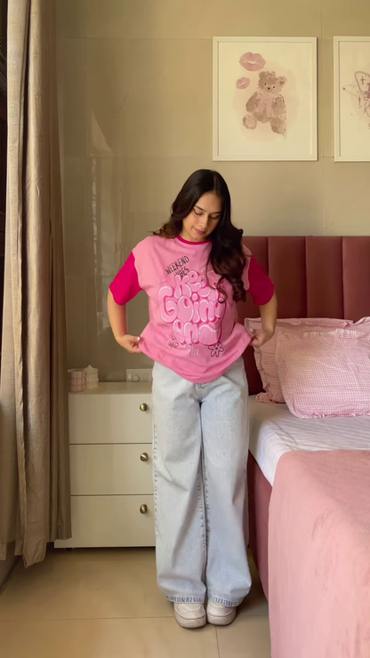 Pink Graphic T-Shirt with “Weekend Vibes” Print Paired with Light Blue Wide-Leg Jeans