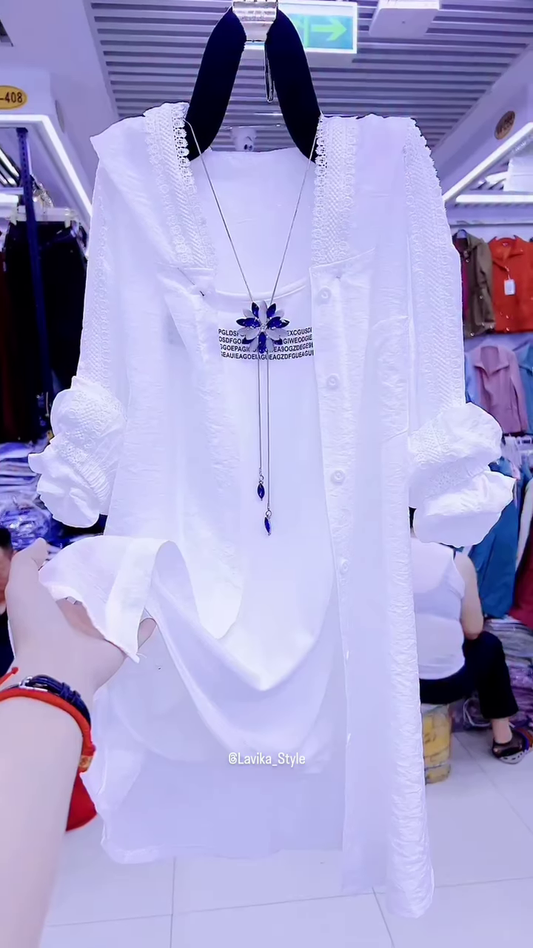 Elegant White Layered Outfit with Striking Blue Necklace