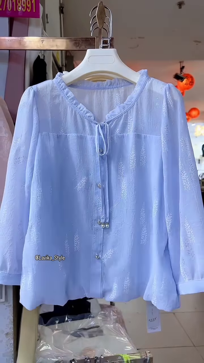 Light Blue Sheer Blouse with Leaf Pattern and Pearl Buttons