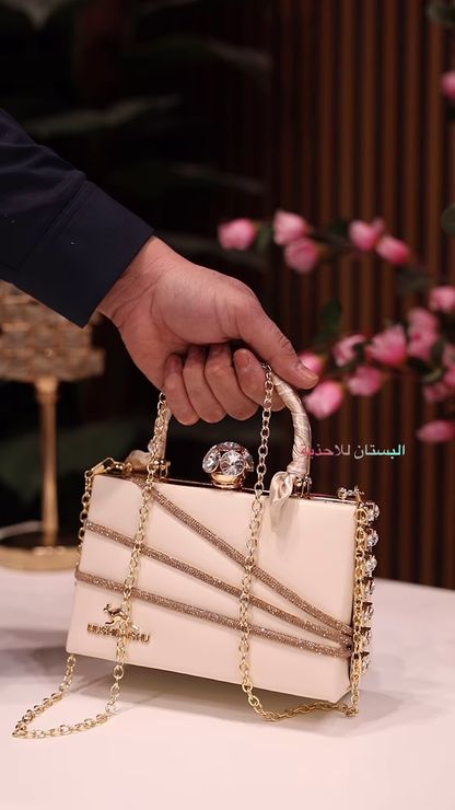 Elegant Ivory Clutch with Rhinestone Embellishments and Chain Strap