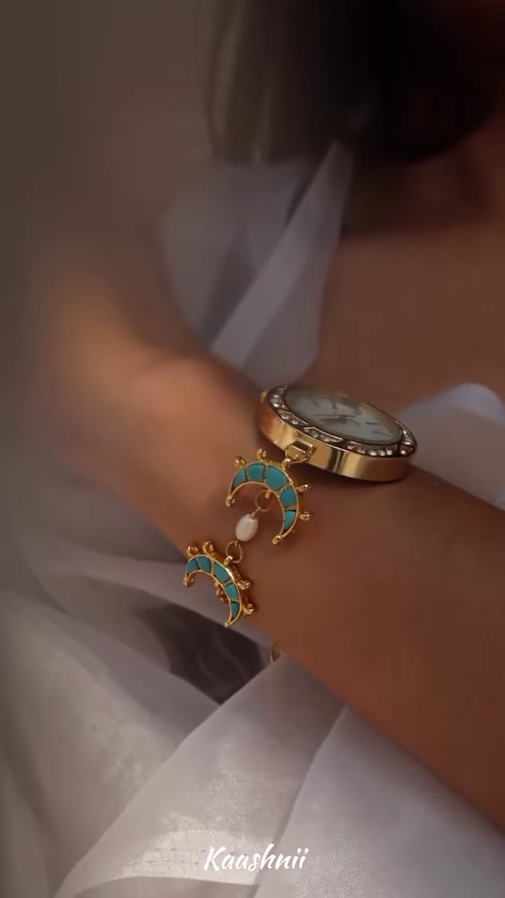 Whimsical Gold-Toned Wristwatch with Crescent Moon and Pearl Accents – Celestial Timepiece