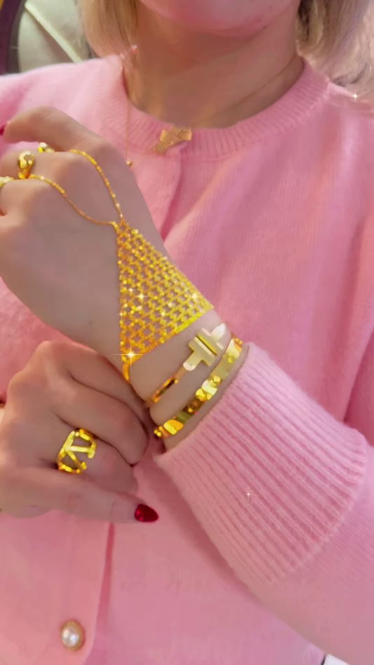 Ornate Gold-Toned Hand Chain Bracelet with Intricate Mesh and Ring Attachments