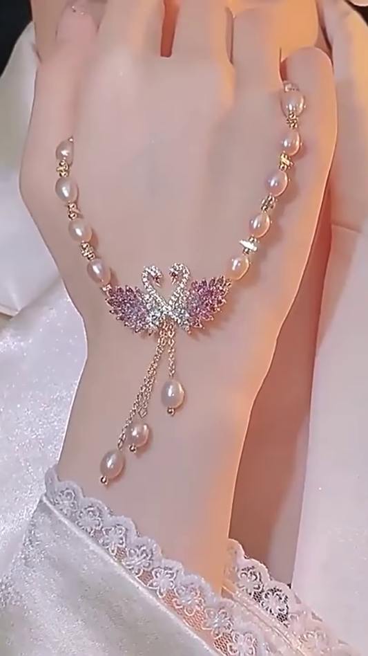 Elegant Pearl Necklace with Sparkling Swan Pendant and Gemstone Accents