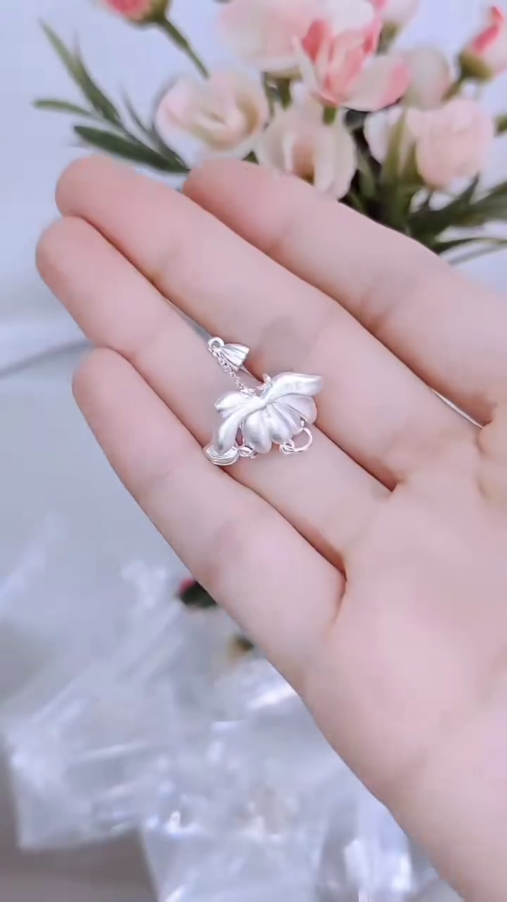 Silver Lotus Pendant Necklace with Tassel Details