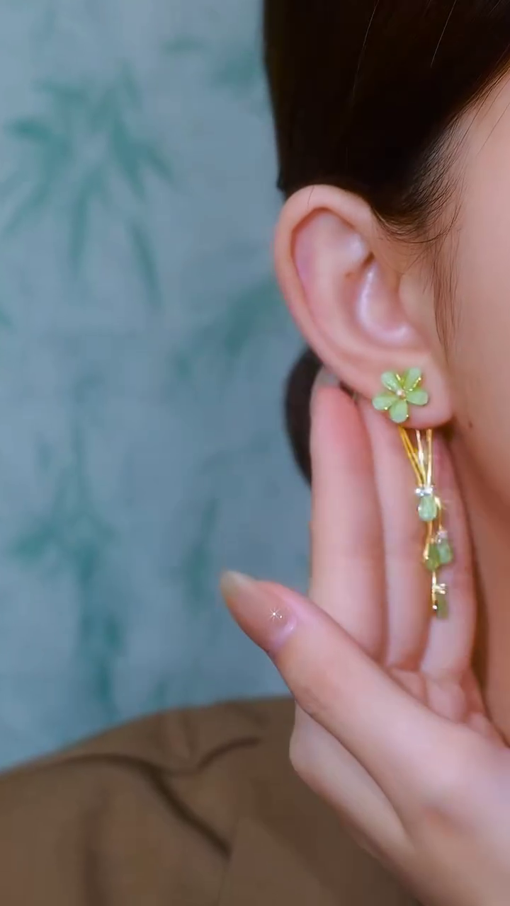 Whimsical Gold-Toned Flower Drop Earrings with Green Gemstone Accents and Delicate Chains