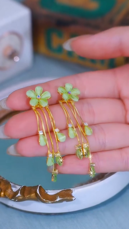 Whimsical Gold-Toned Flower Drop Earrings with Green Gemstone Accents and Delicate Chains
