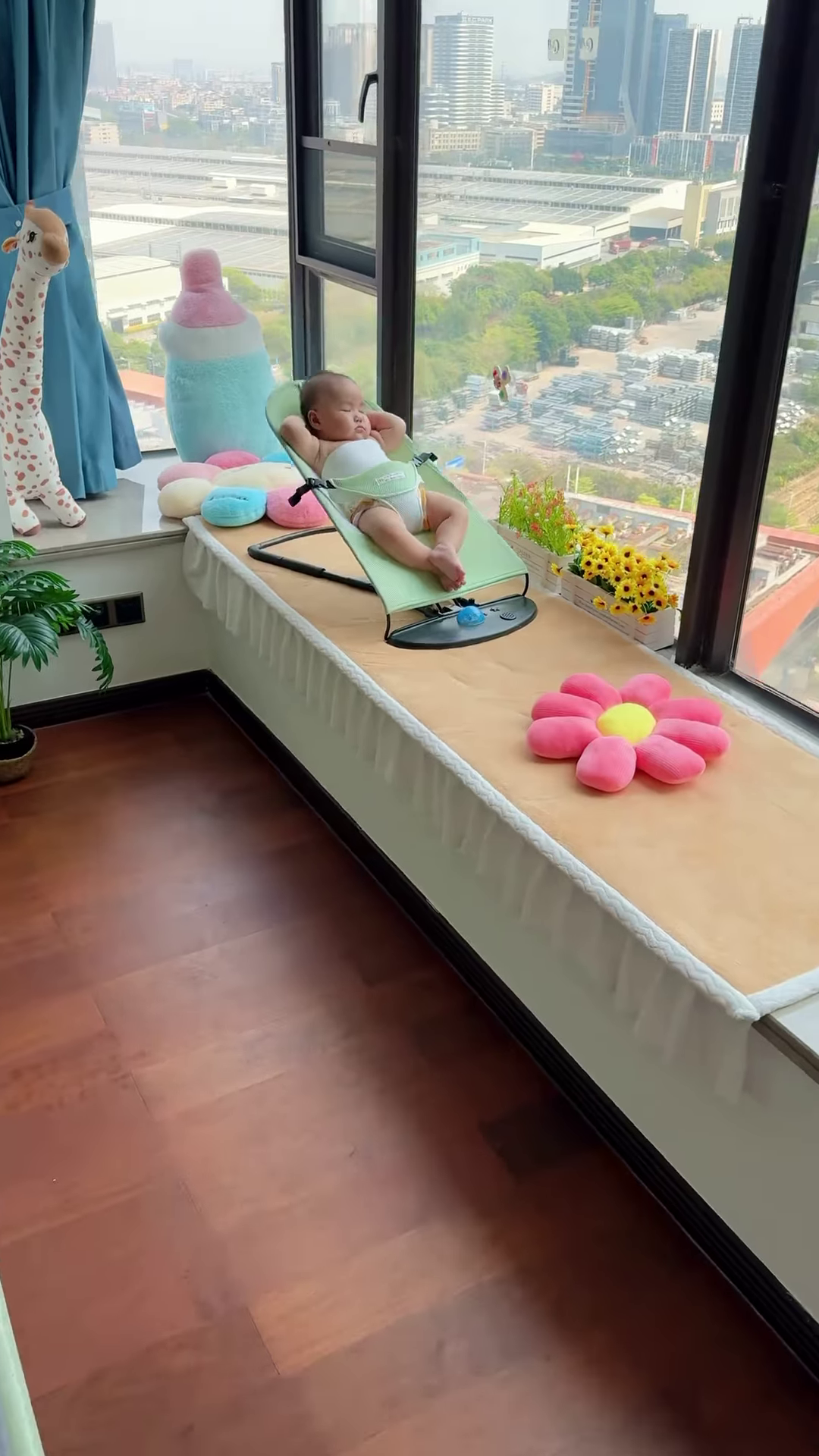 Peaceful Newborn Baby Sleeping Soundly in a Comfortable Bouncer Seat by the Window