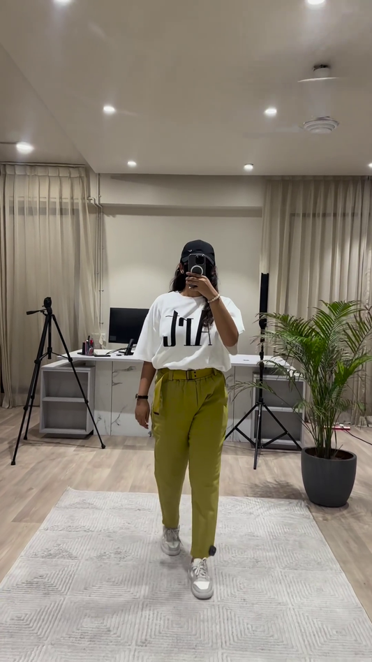 Casual Chic Outfit: White Graphic Tee, Maroon Wide-Leg Pants, and Black Cap
