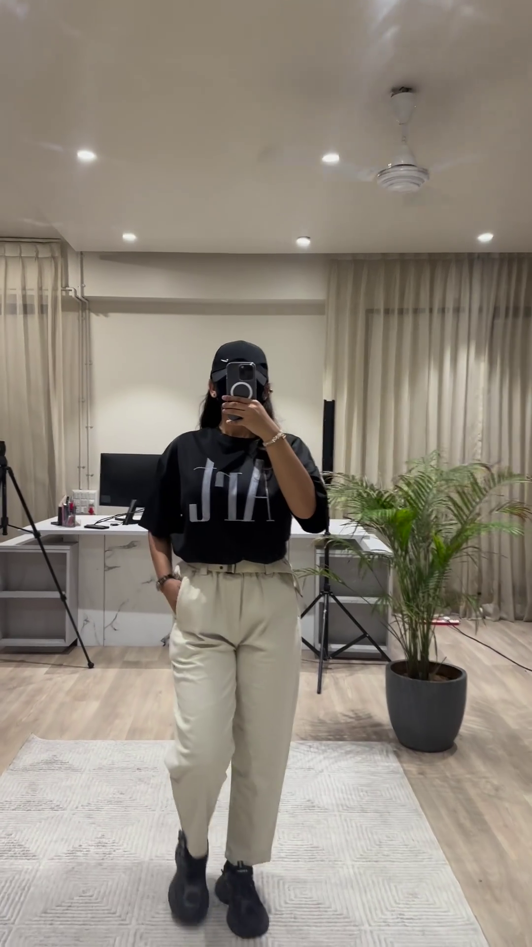Casual Chic Outfit: White Graphic Tee, Maroon Wide-Leg Pants, and Black Cap