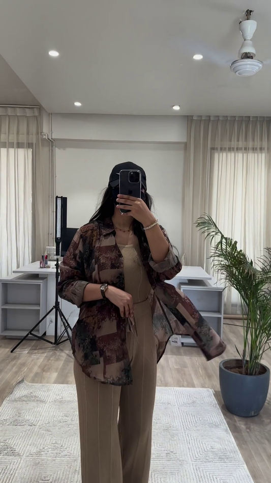 Bohemian Chic Outfit: Patterned Overshirt, Knit Top, and Wide-Leg Pants