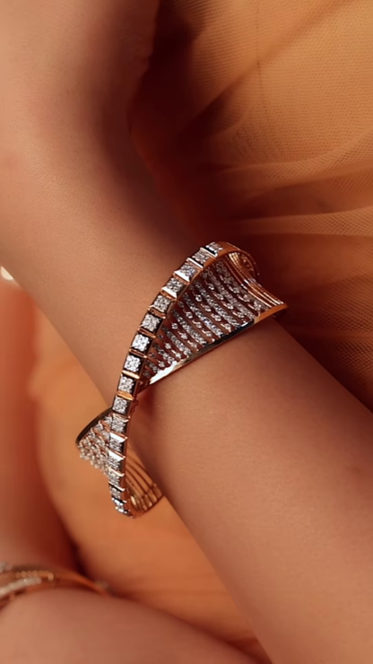 Ornate Gold-Toned Bangle with Kundan, Emerald, and Pearl Detailing